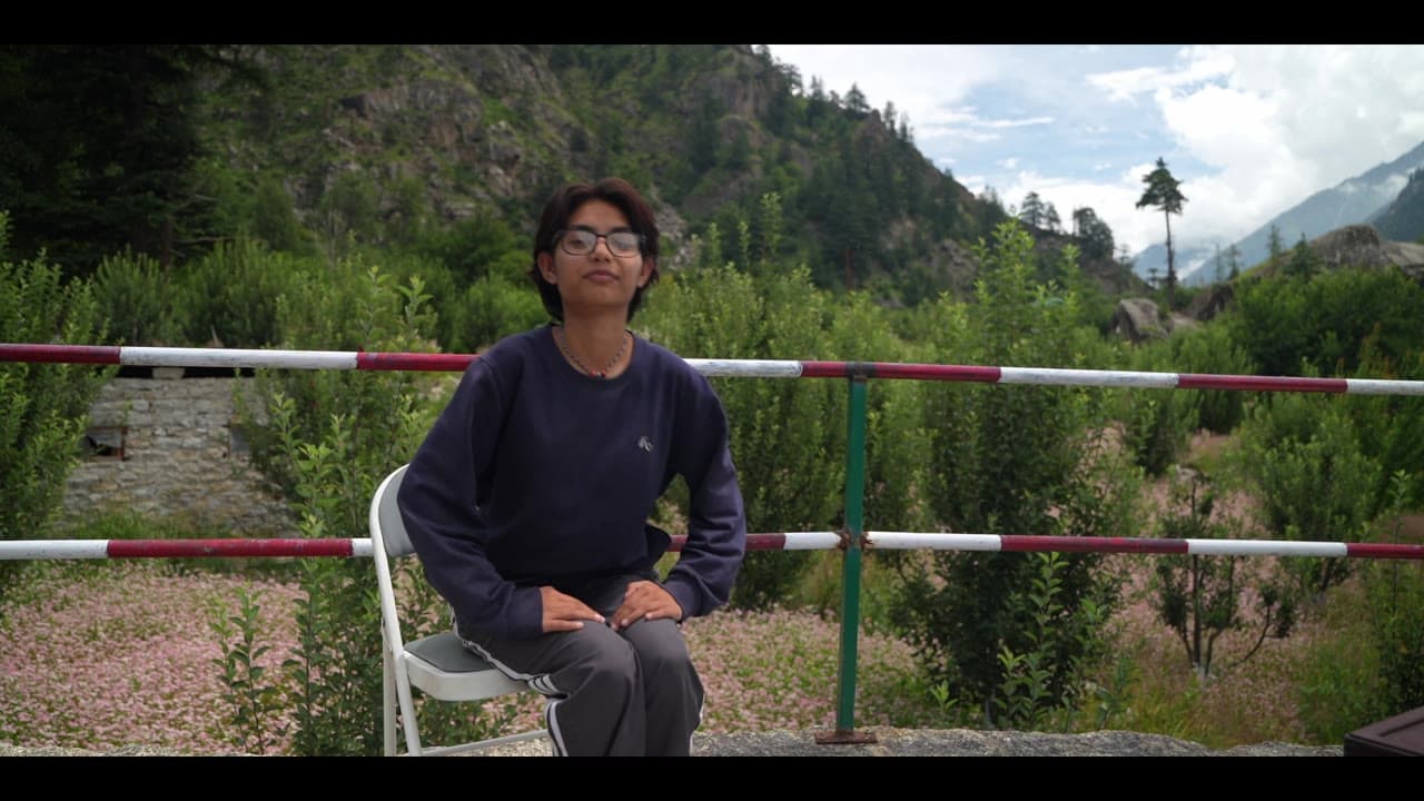 A grower from Taste of Kinnaur speaking to camera in the orchard